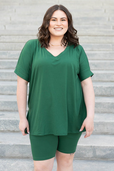 Front view of the dark green set in plus size with biker shorts and over sized top