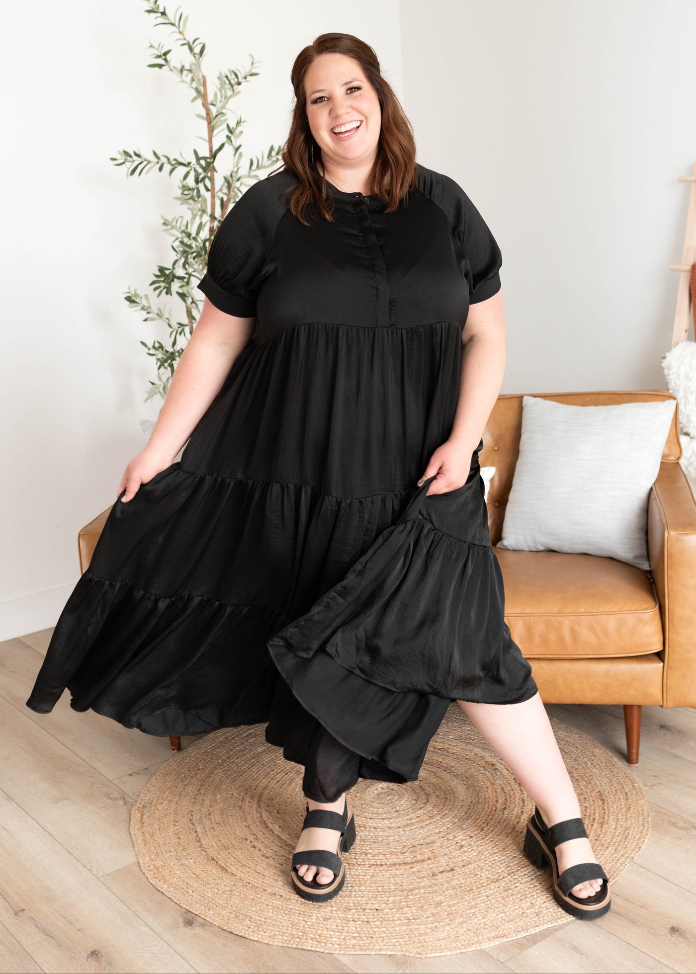 Plus size black satin dress with buttons on the bodice