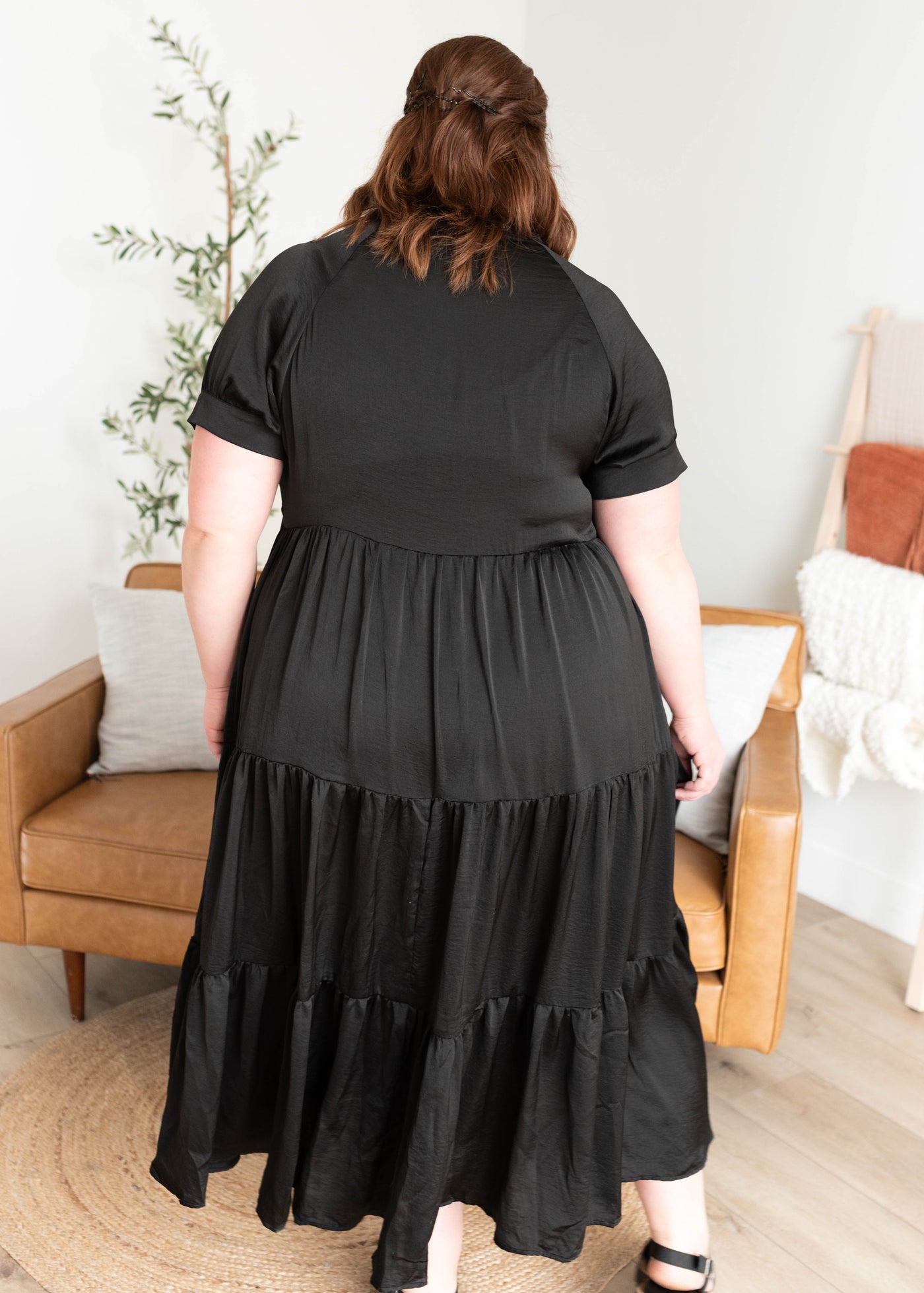 Back view of the plus size black satin dress