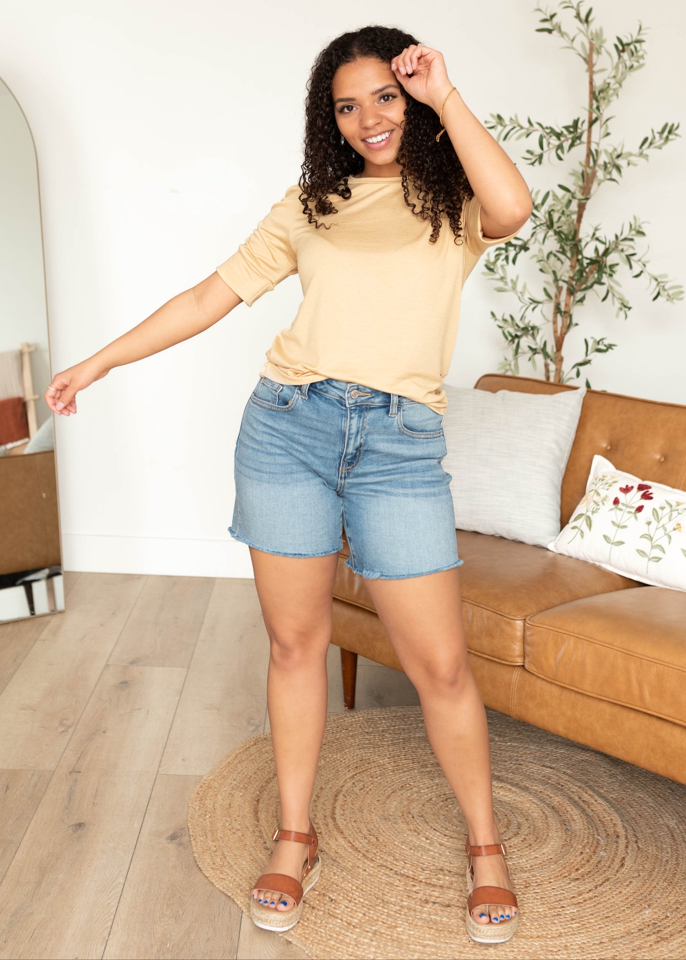 Front view of the small taupe ruffle sleeve top