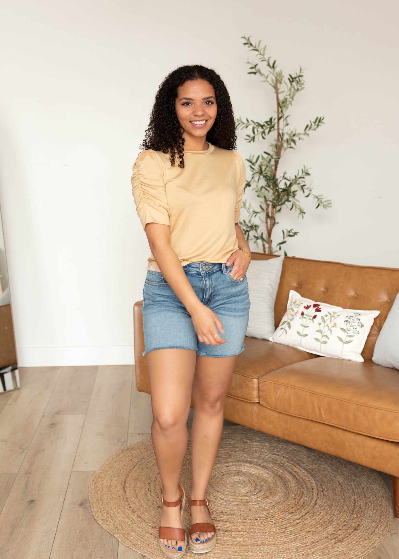 Front view of the taupe ruffle sleeve top