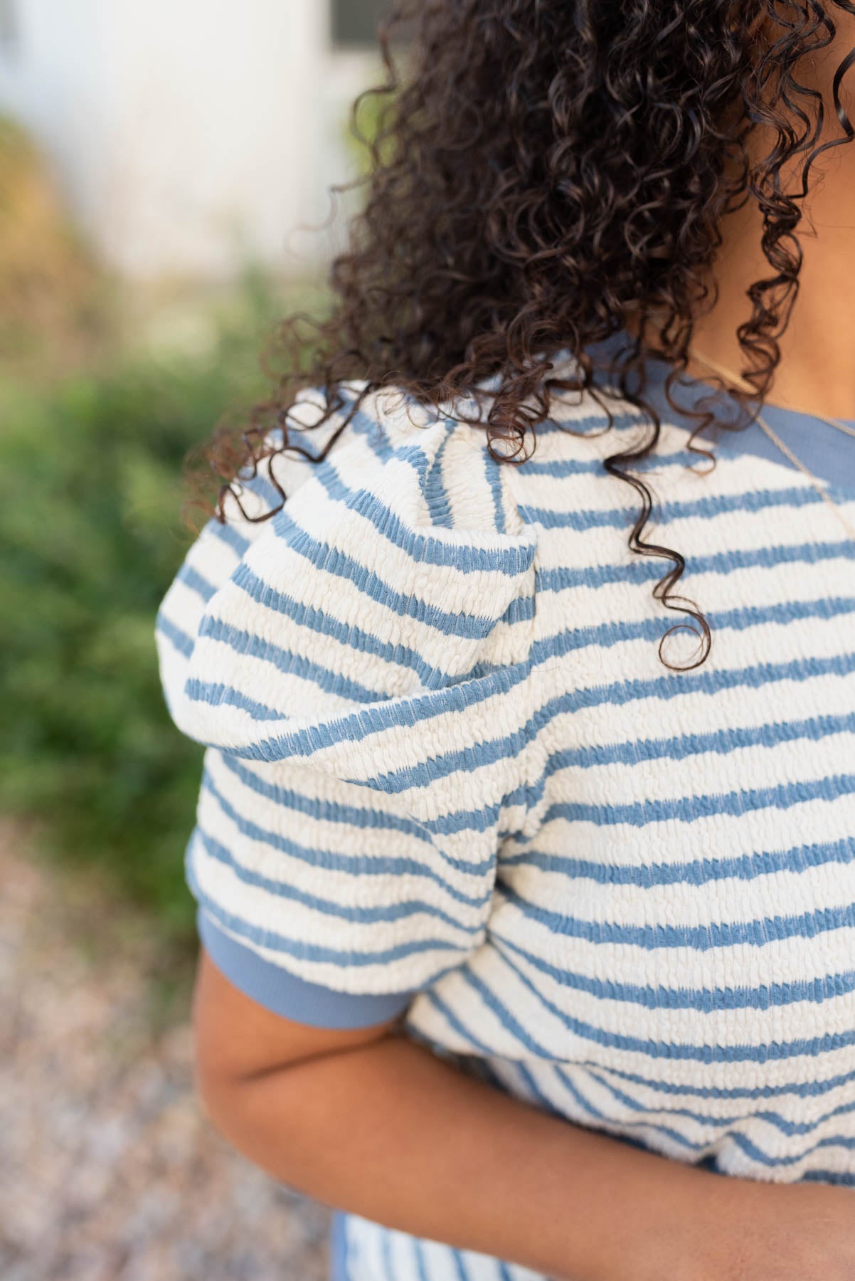 Close up of the sleeve and fabric on th blue stripe top