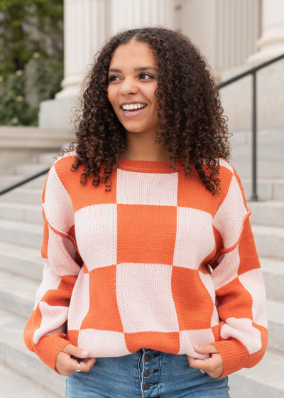 Close up of the rust checker sweater