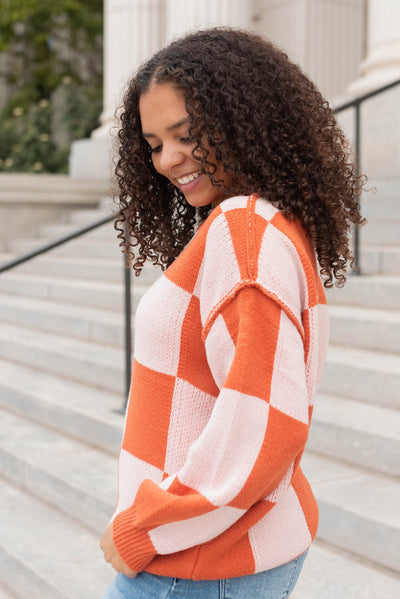 Side view of the rust checker sweater