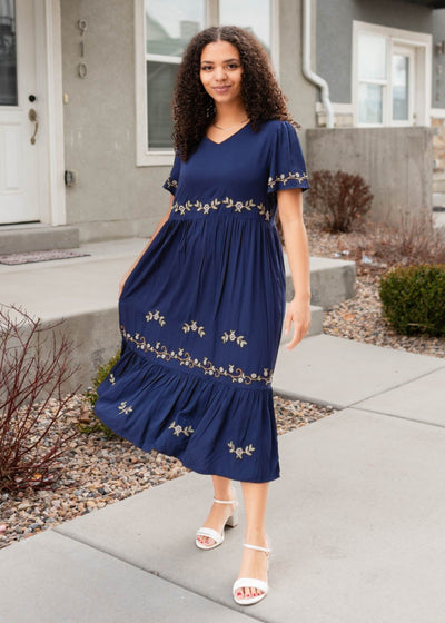 Front view of the navy embroidered dress