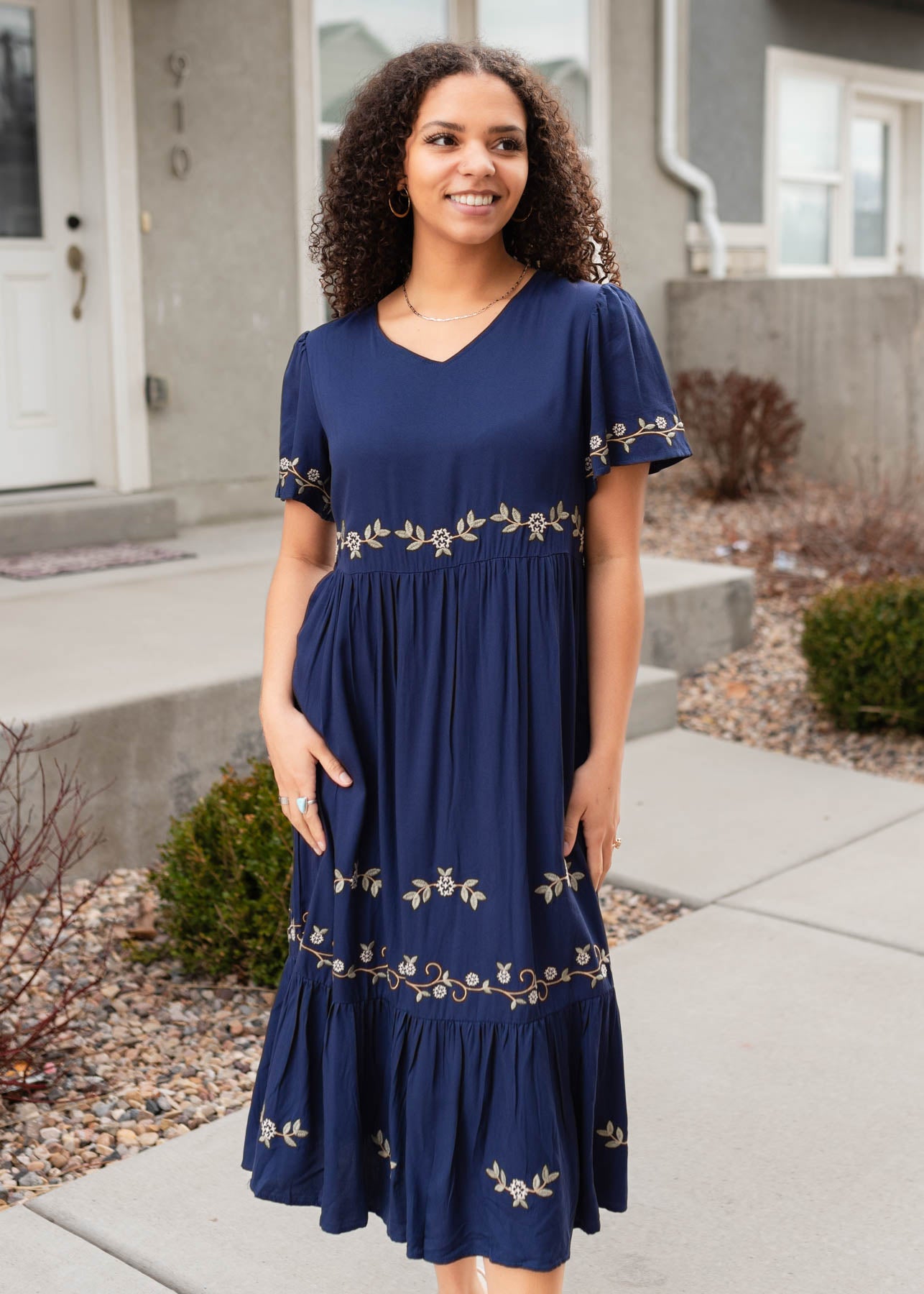 Navy embroidered dress with embroidery on the sleeves, waist and skirt