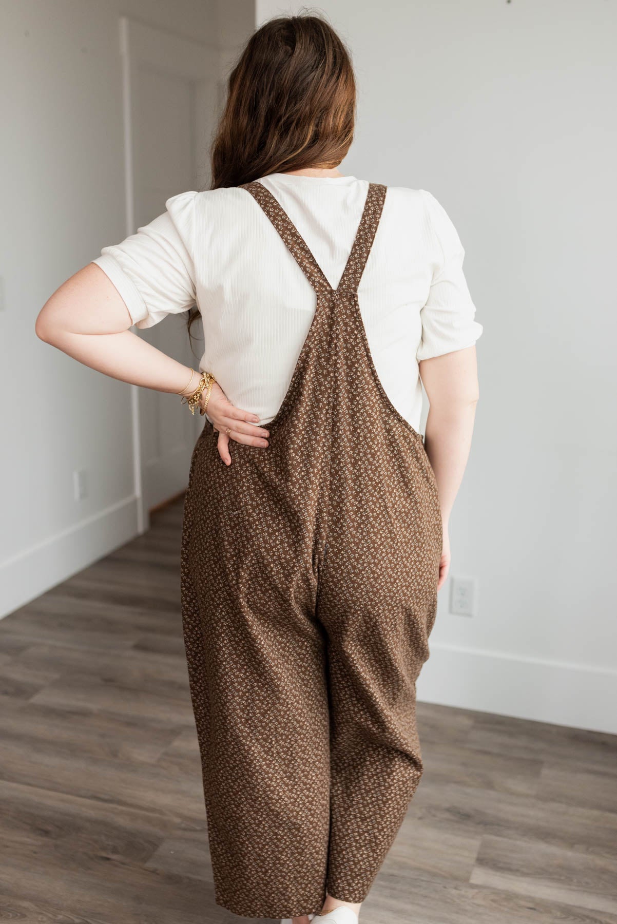 Back view of the brown floral printed overalls in plus size