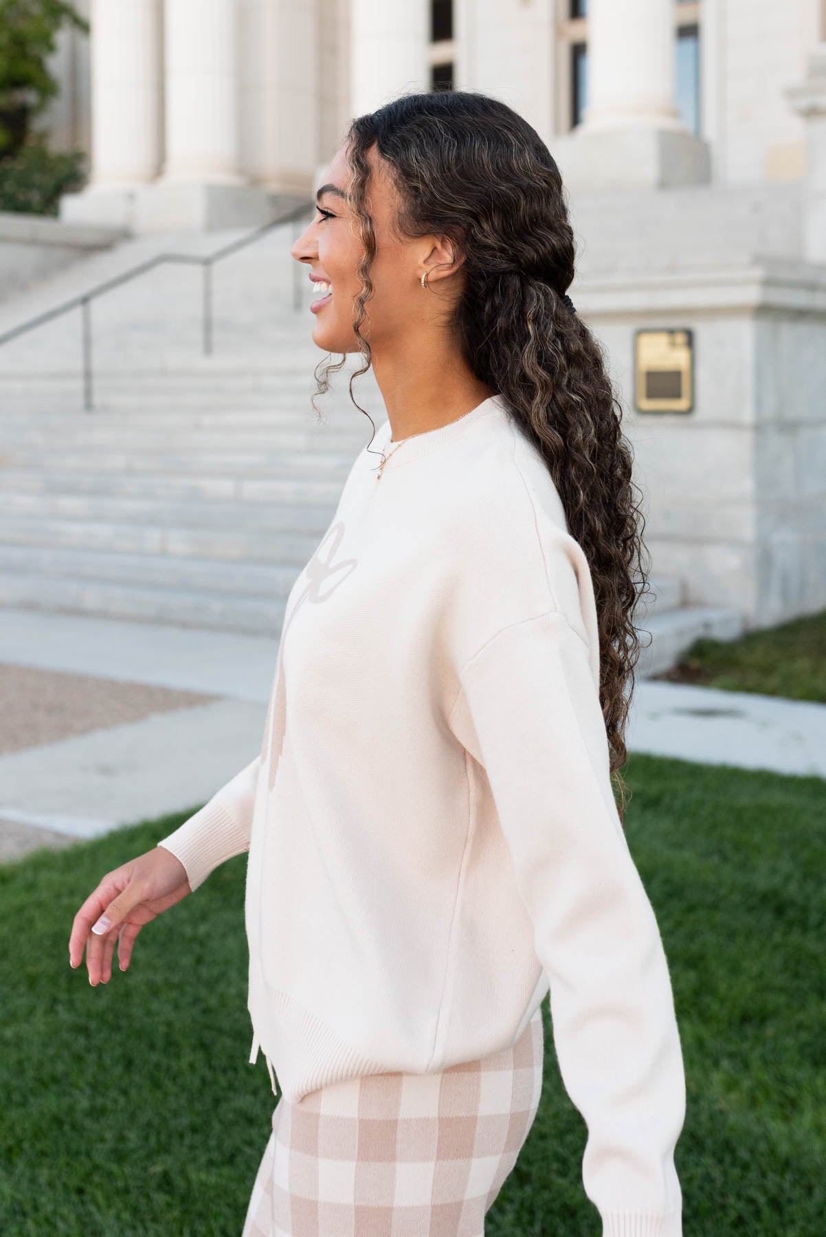 Side view of the oatmeal ribbon sweater