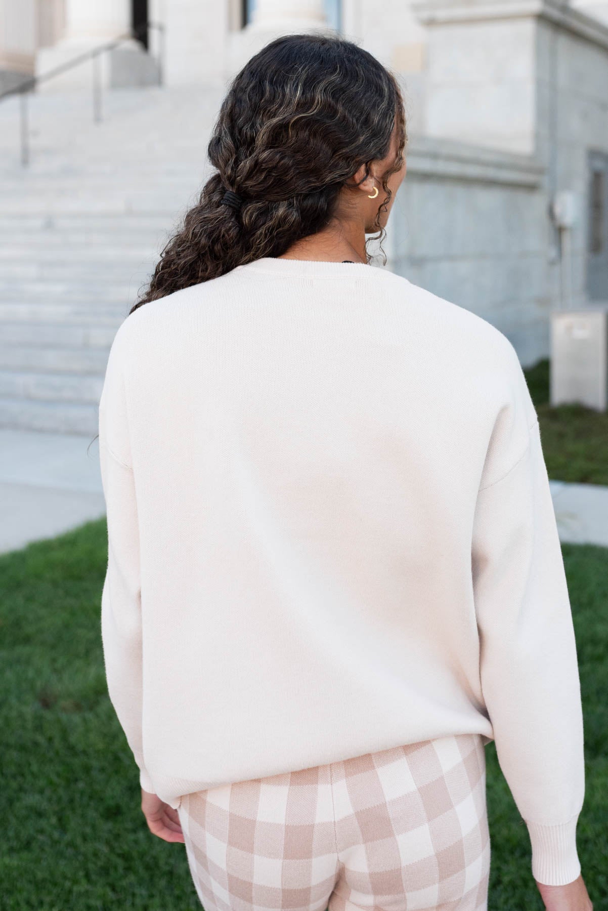 Back view of the oatmeal ribbon sweater