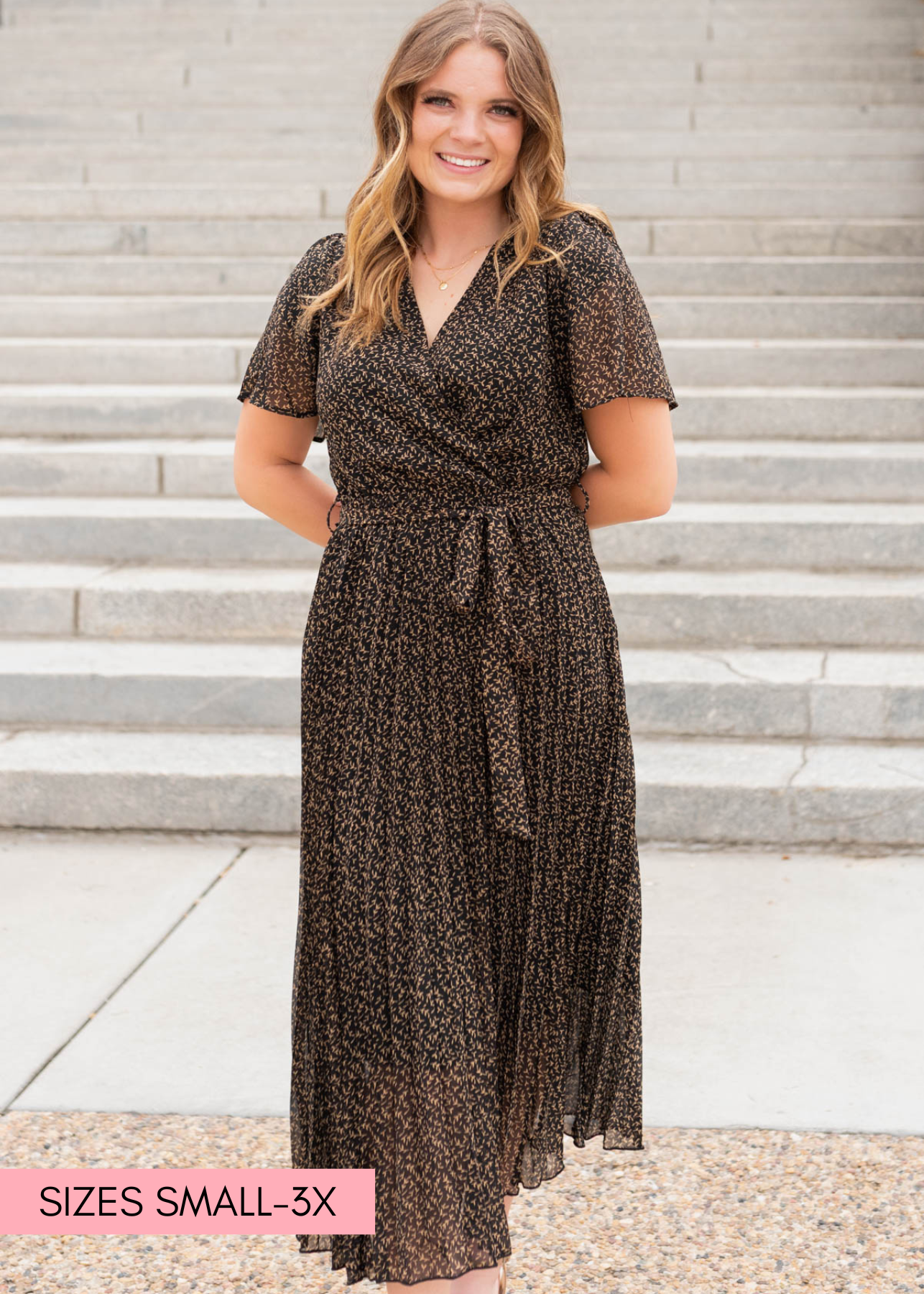 Black pleated dress with wrap style bodice