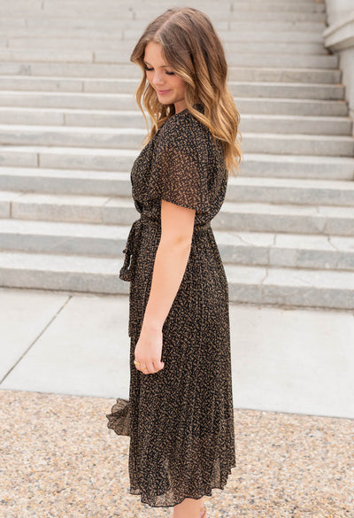 Side view of the black pleated dress