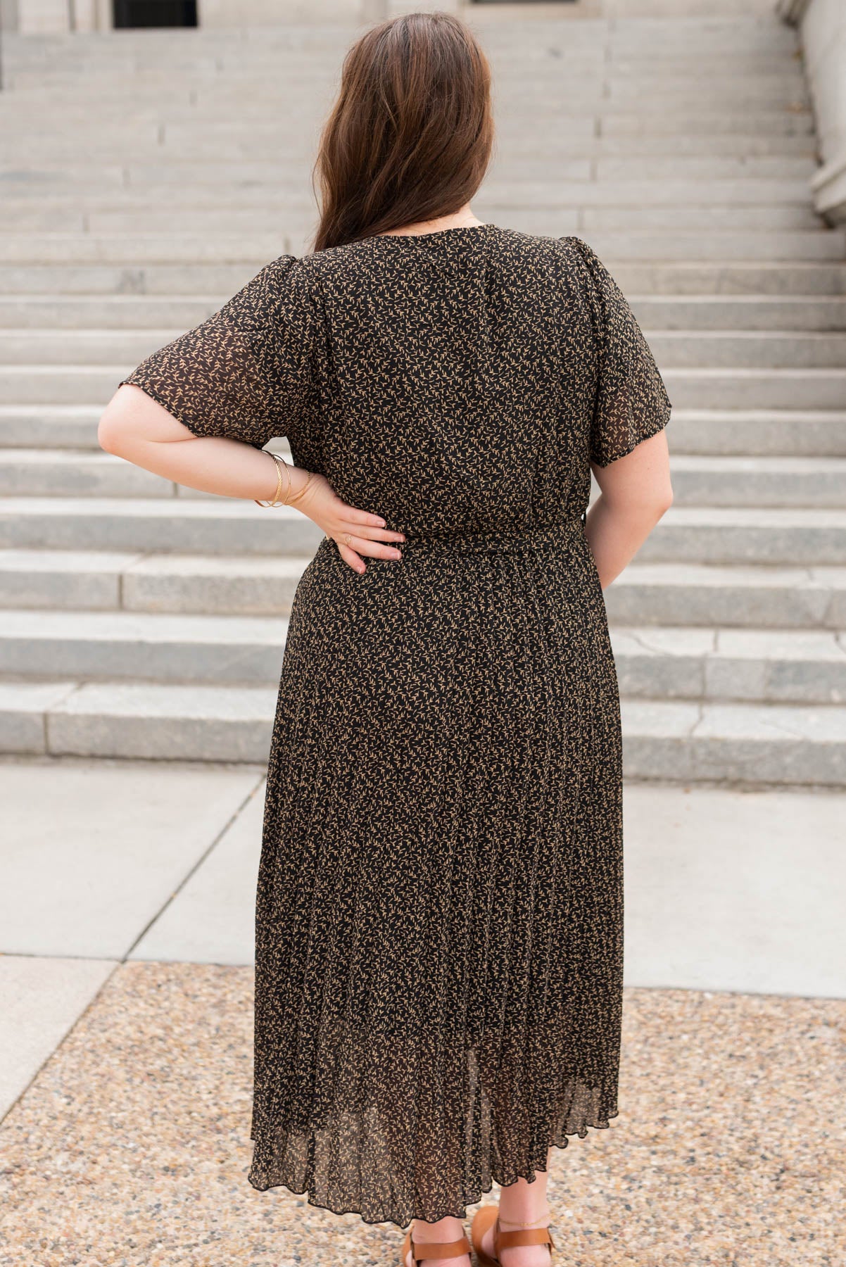 Back view of the black pleated dress