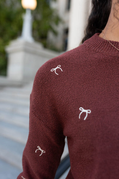 Close up of the bows ont he sienna bow sweater