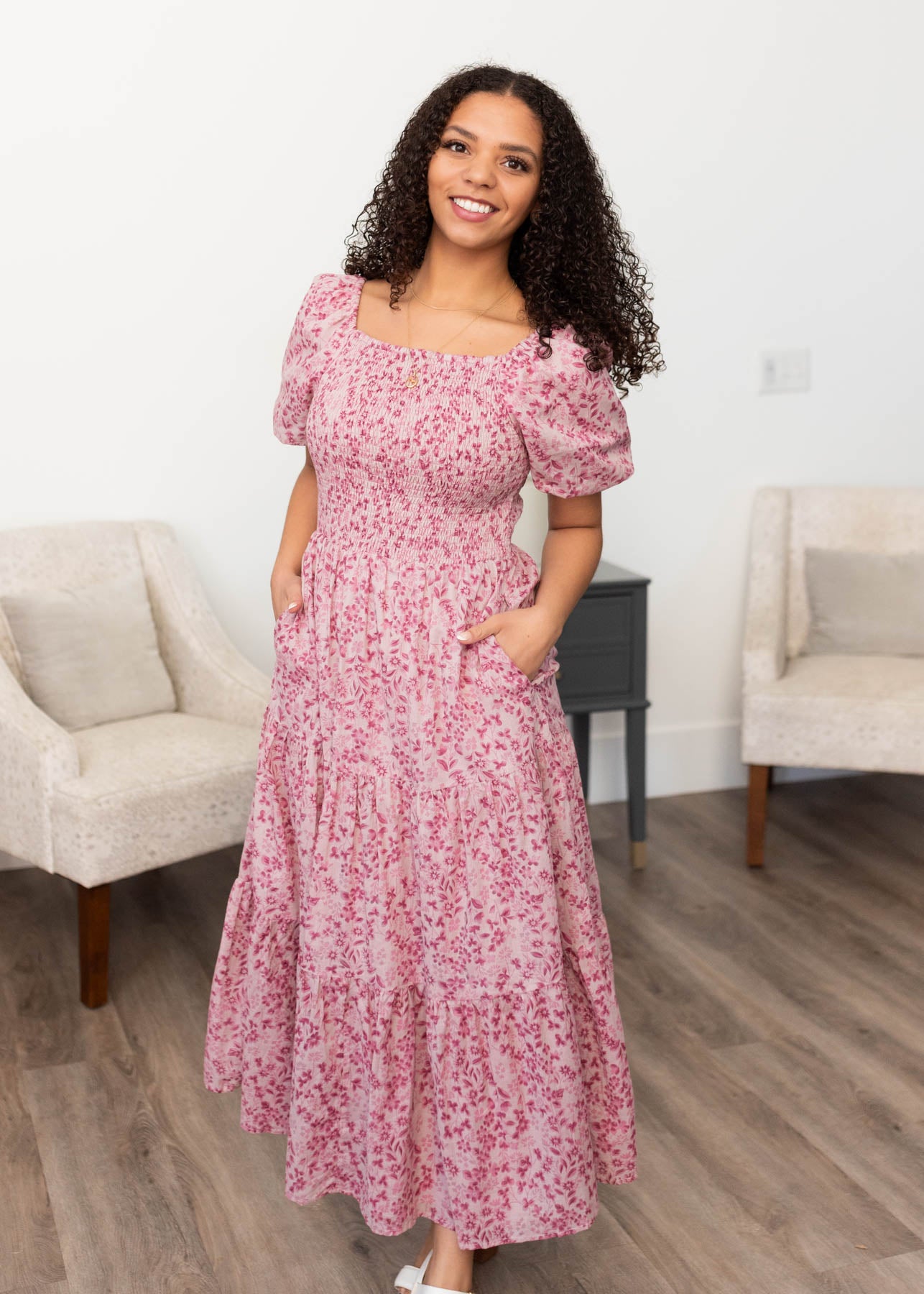 Blush floral tiered dress with a smocked bodice and pockets