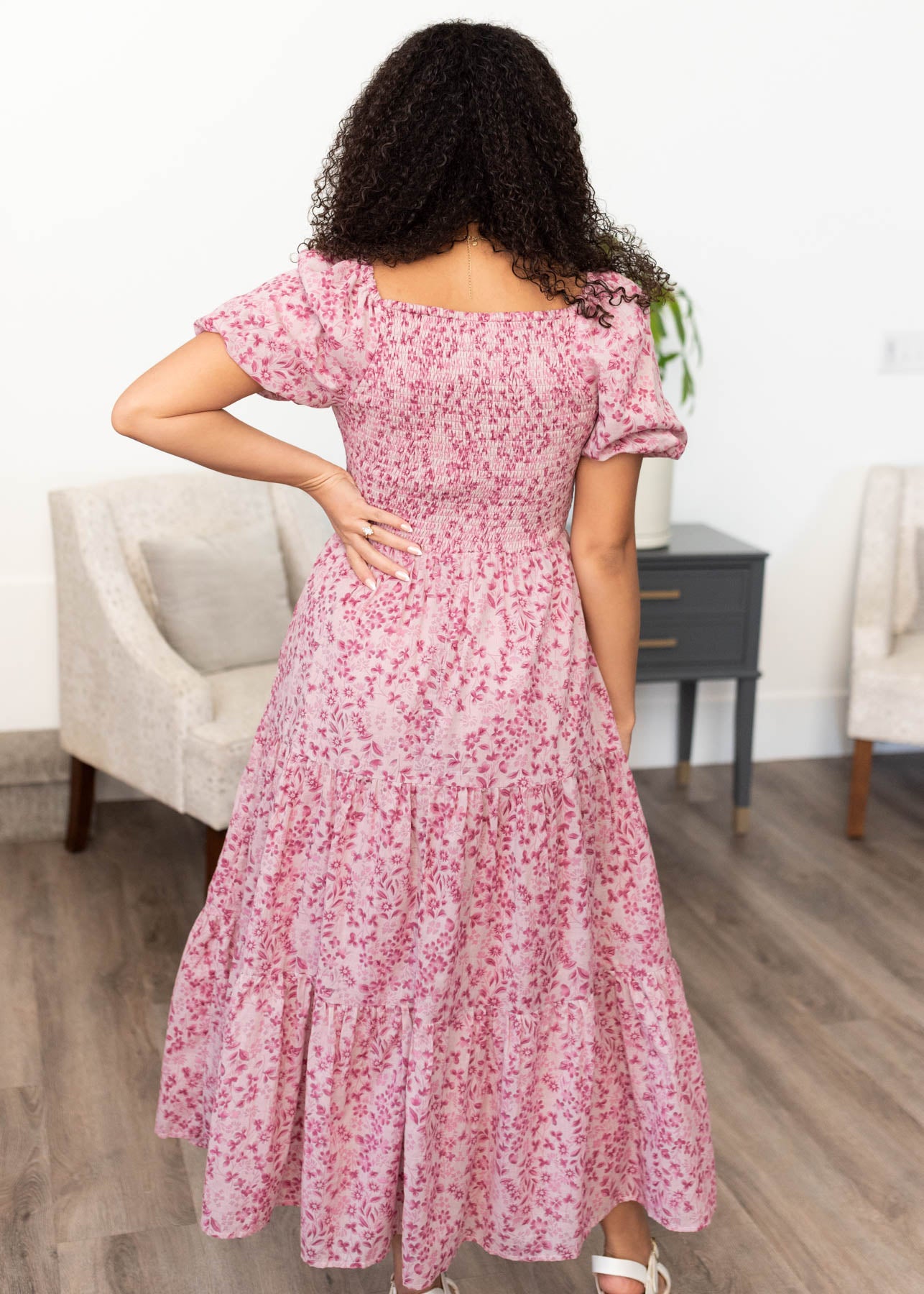 Back view of the blush floral tiered dress