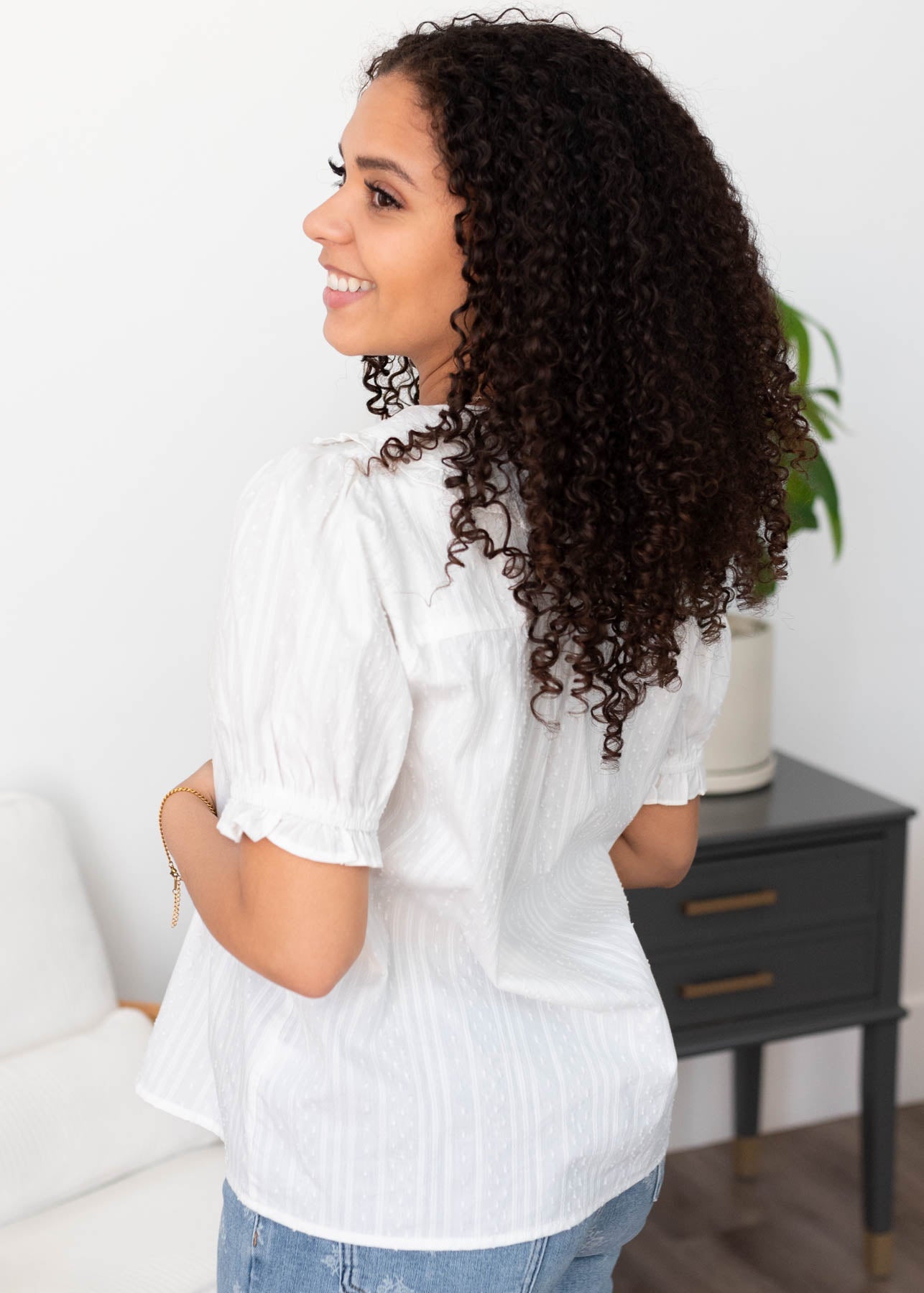 Side view of the white button blouse