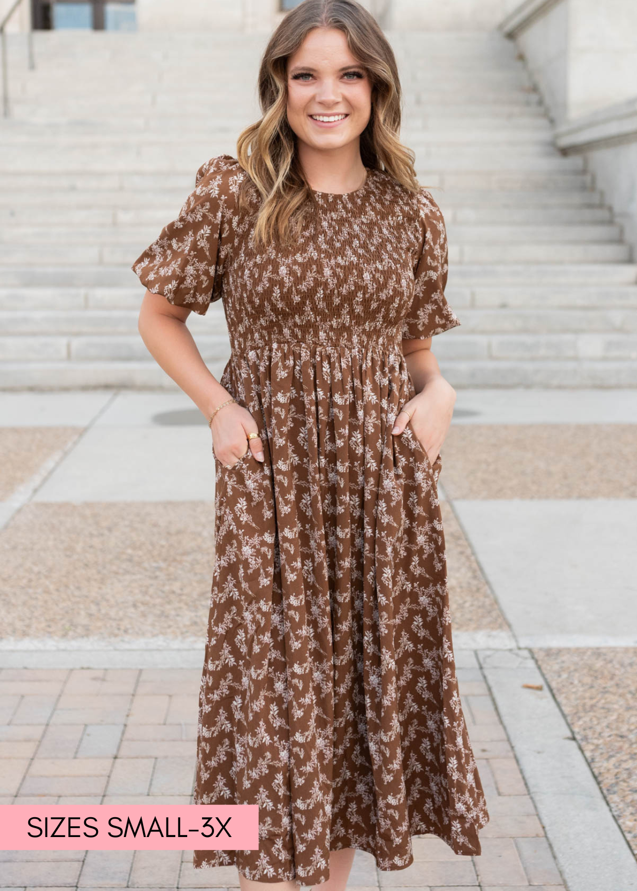 Brown floral smocked dress with a smocked bodice, pockets and short sleeves