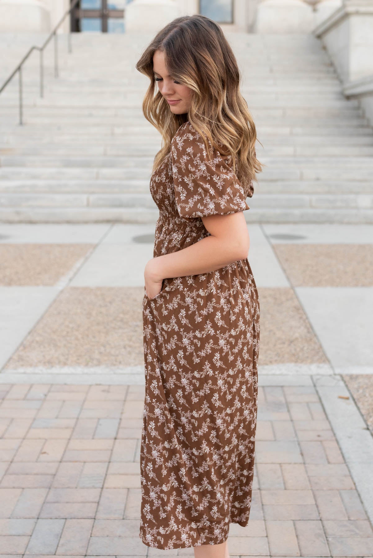 Side view of the brown floral smocked dress