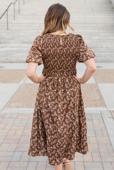 Back view of the brown floral smocked dress