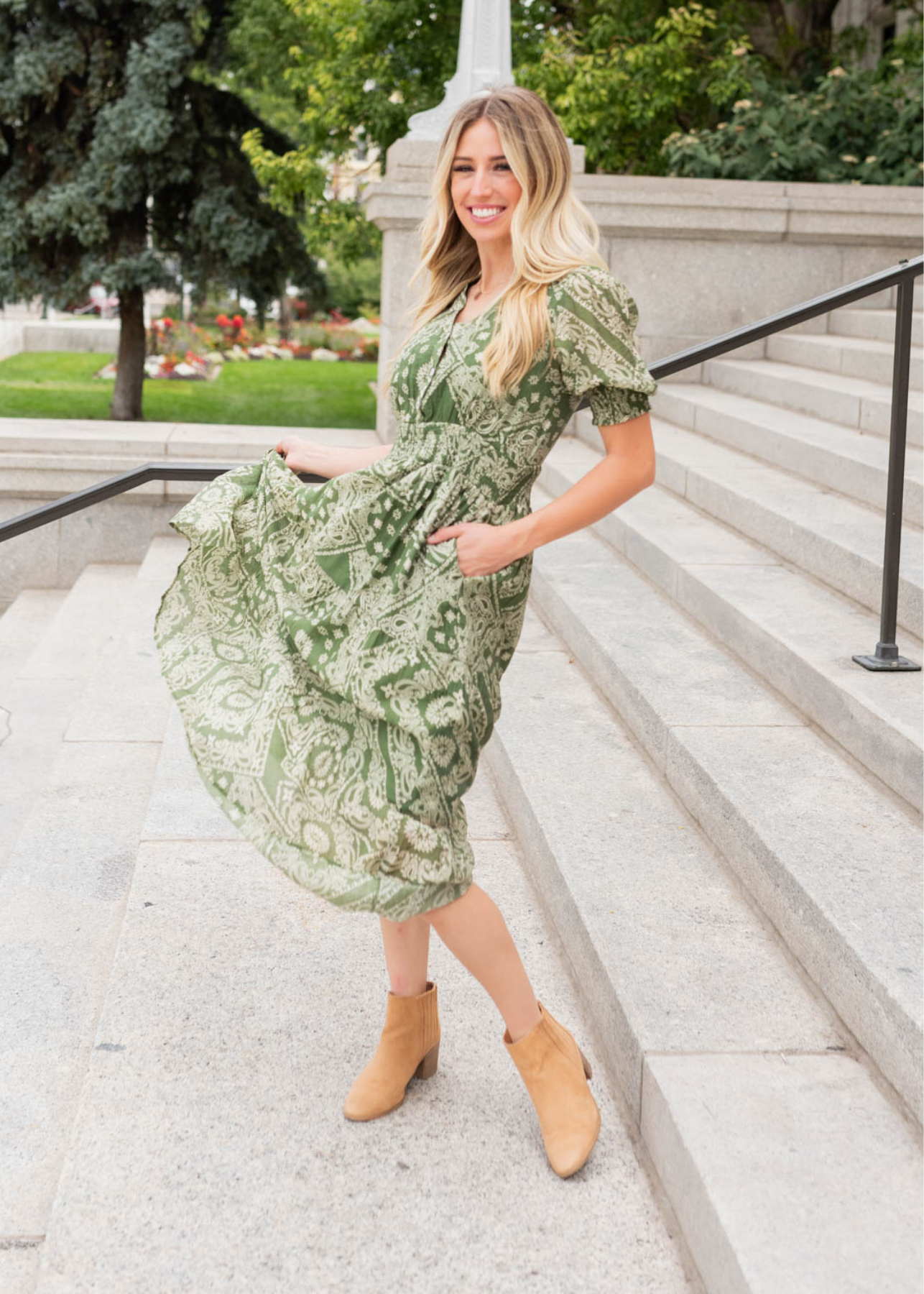 Green floral tiered dress with elastic banding around the waist