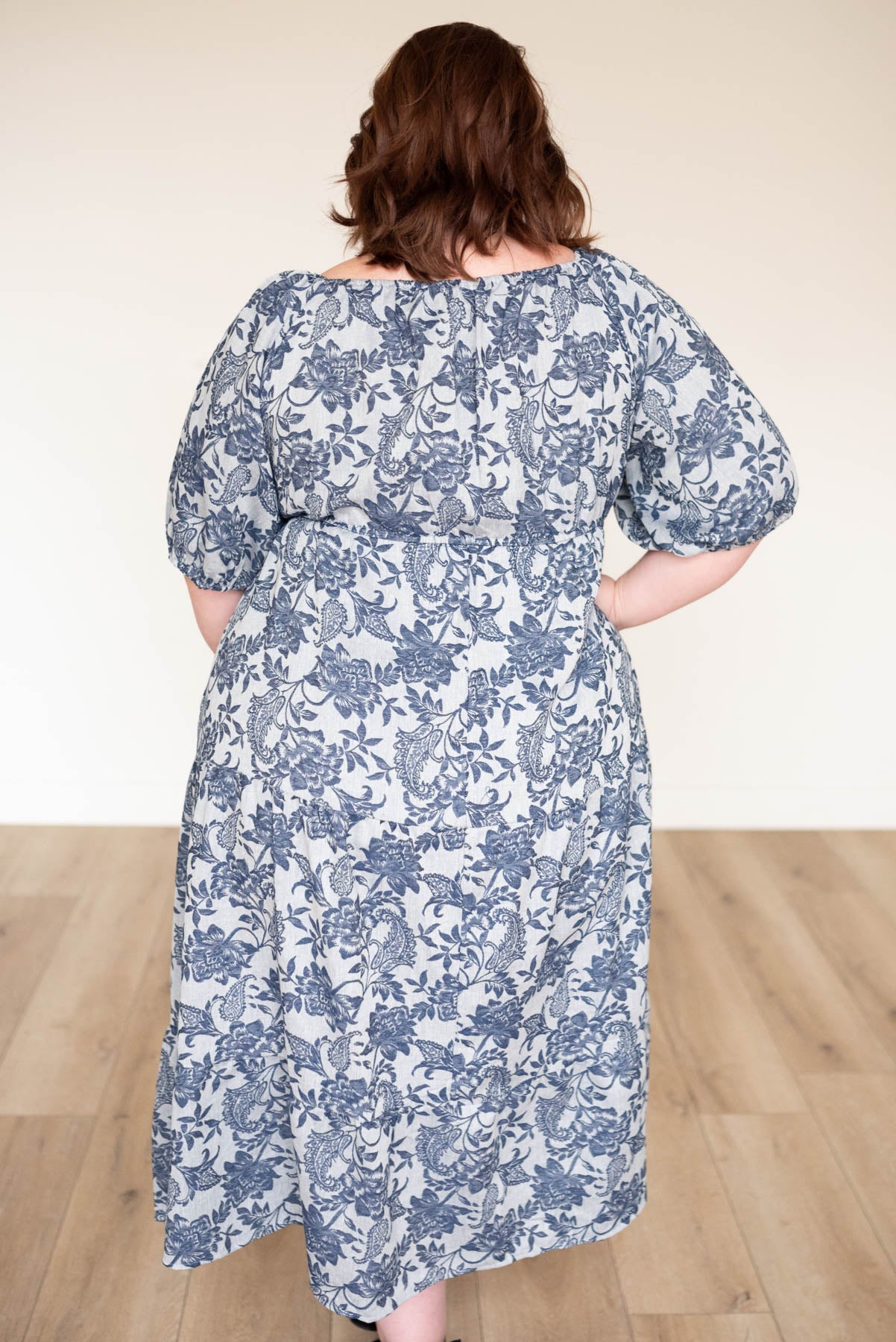 Back view of the plus size navy floral dress