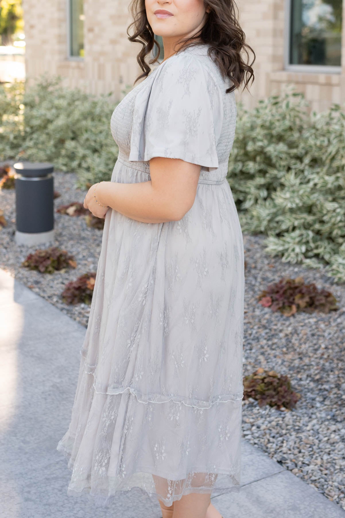 Side view of the plus size grey floral lace dress