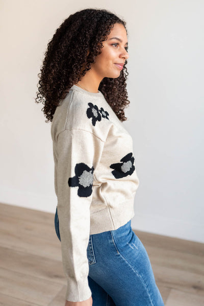 Side view of the khaki black floral sweater