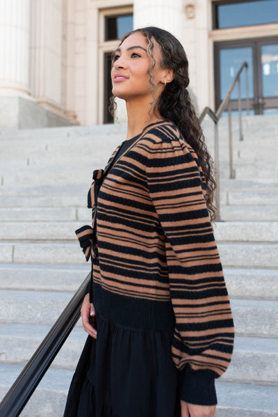 Side view of the black bow cardigan