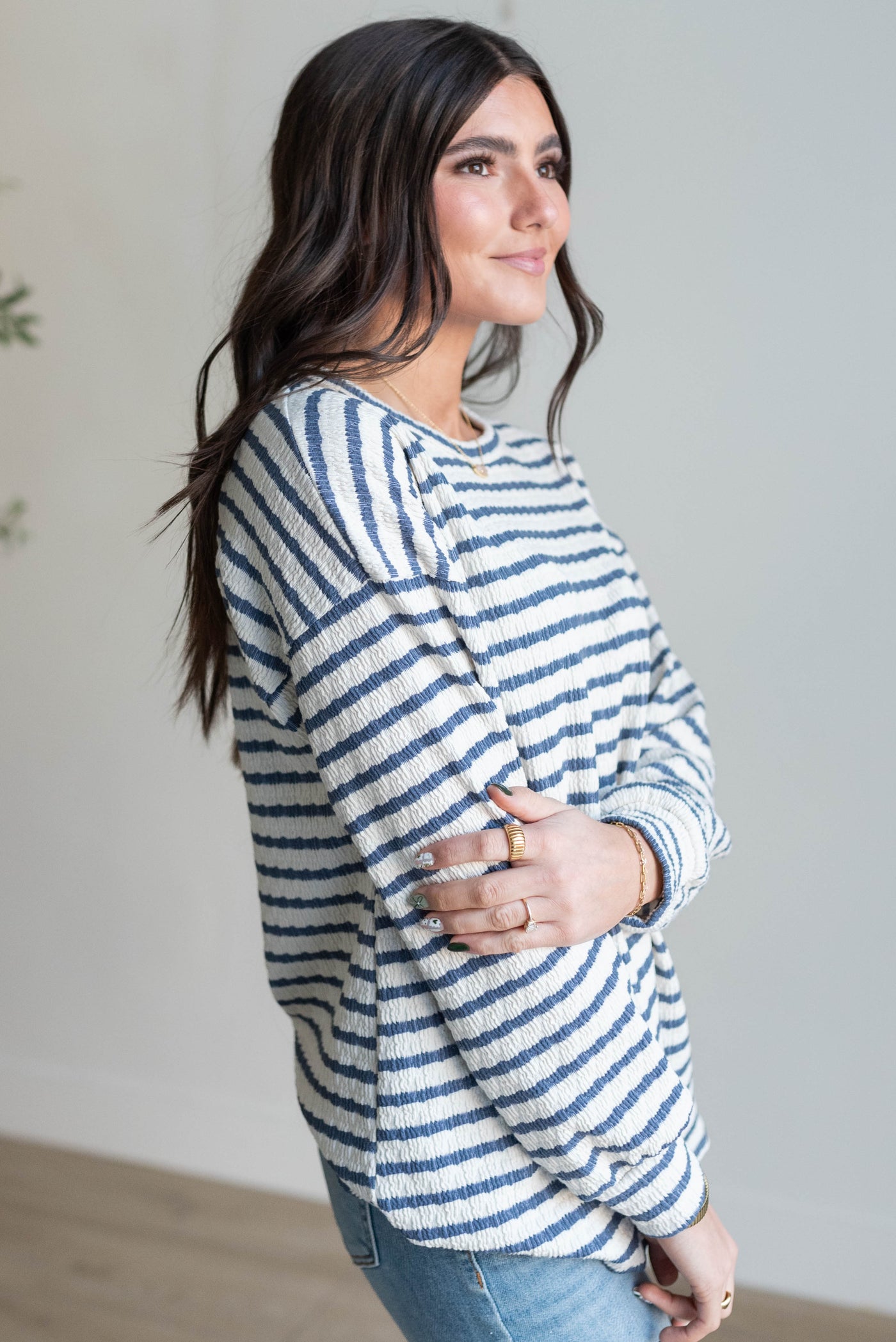 Side view of the indigo stripe long sleeve top