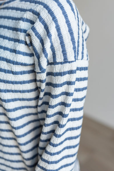 Close up of the fabric on the indigo stripe long sleeve top