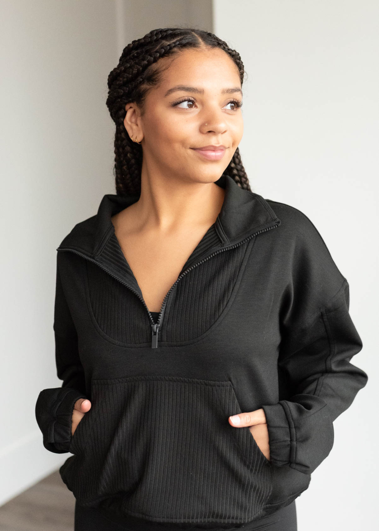 Black half zip pullover with front pocket