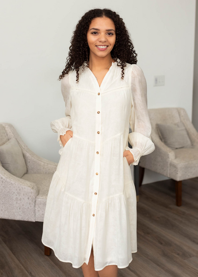 Ivory button down dress with pockets and a tiered skirt