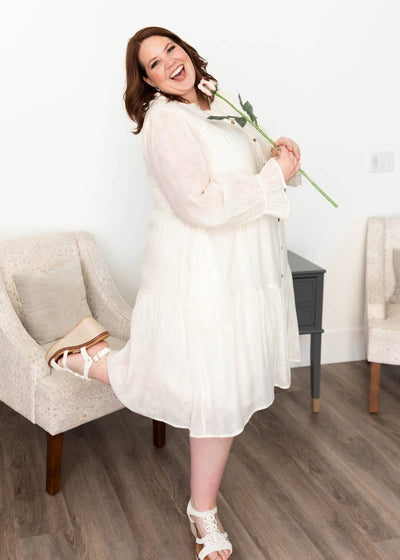 Plus size ivory button down dress that is lined and has sheer sleeves