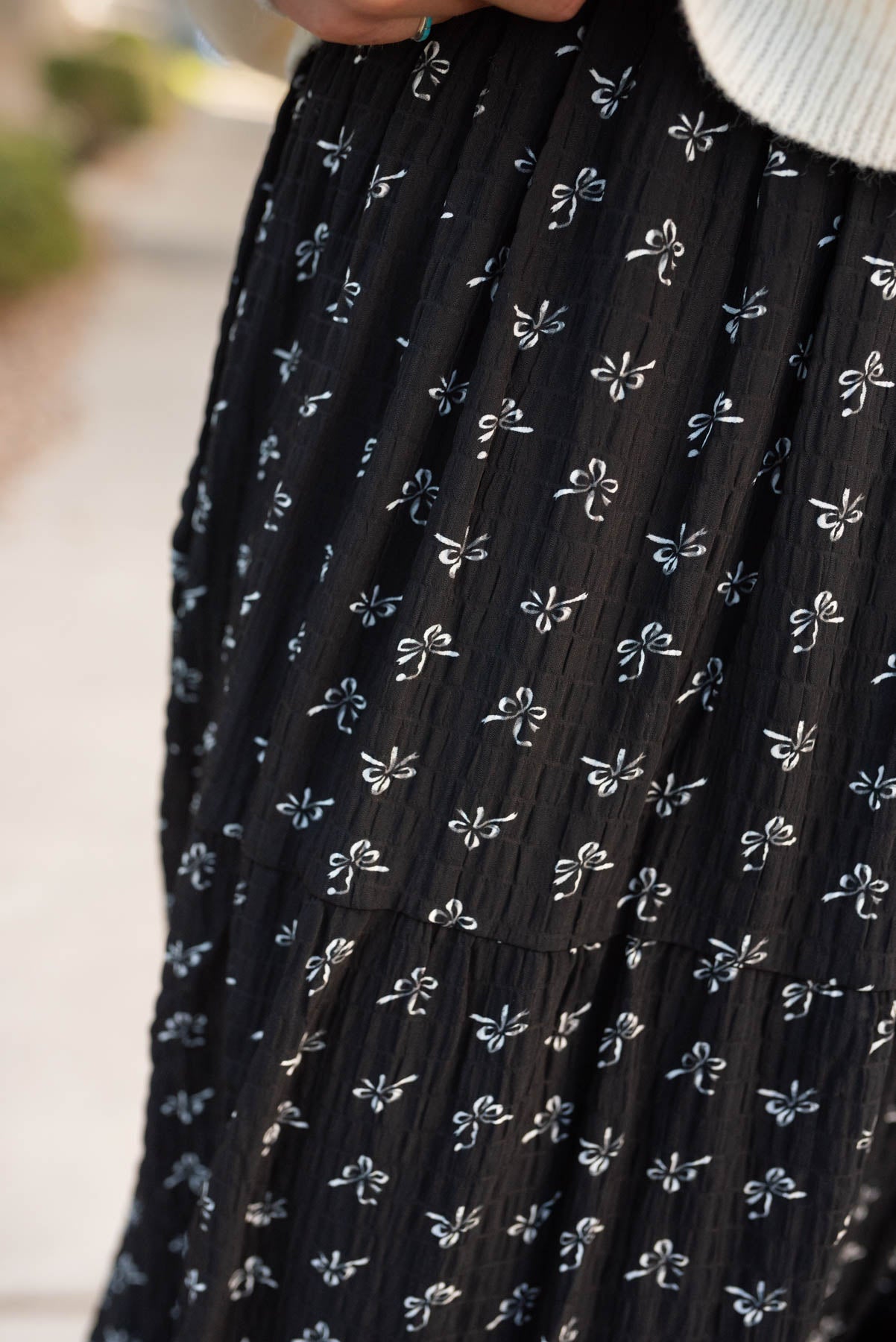 Close up of the black bow skirt