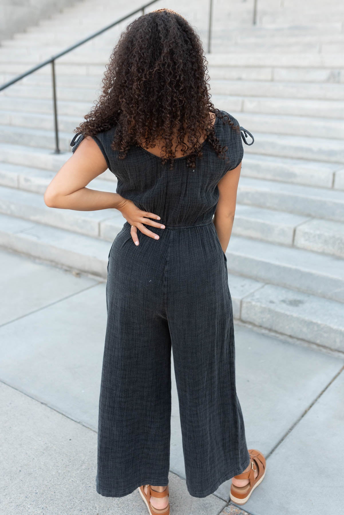 Back view of the black mineral wash jumpsuit