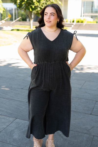 Plus size black mineral wash jumpsuit with pockets