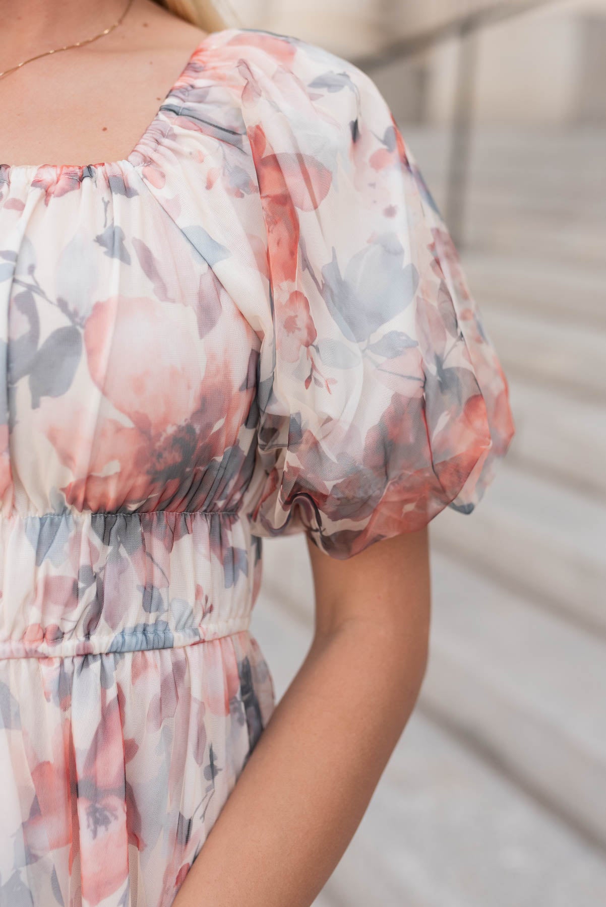 Close up of the fabric on the cream floral dress