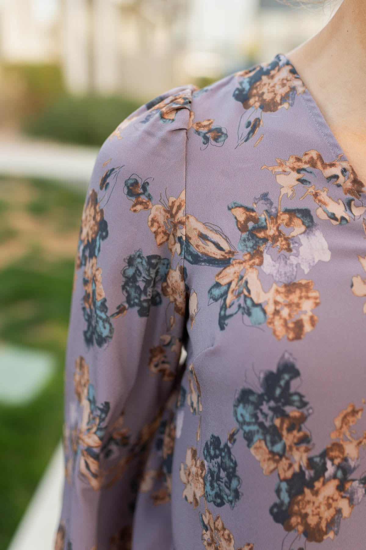 Close up of the fabric on the plum floral blouse