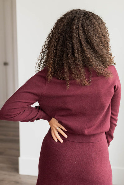 Back view of the burgundy knit sweater