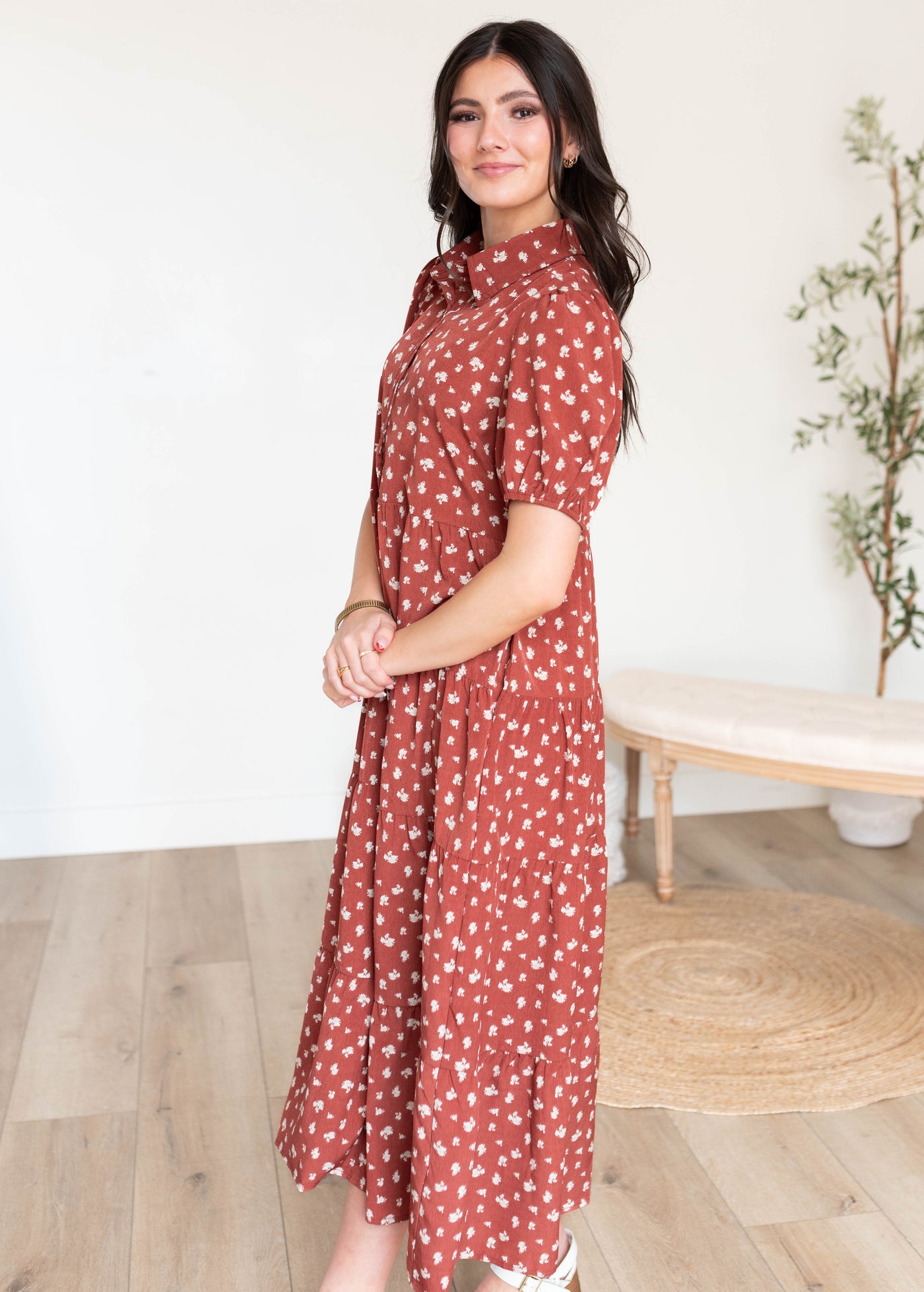 Side view of the terracotta collared dress with pockets