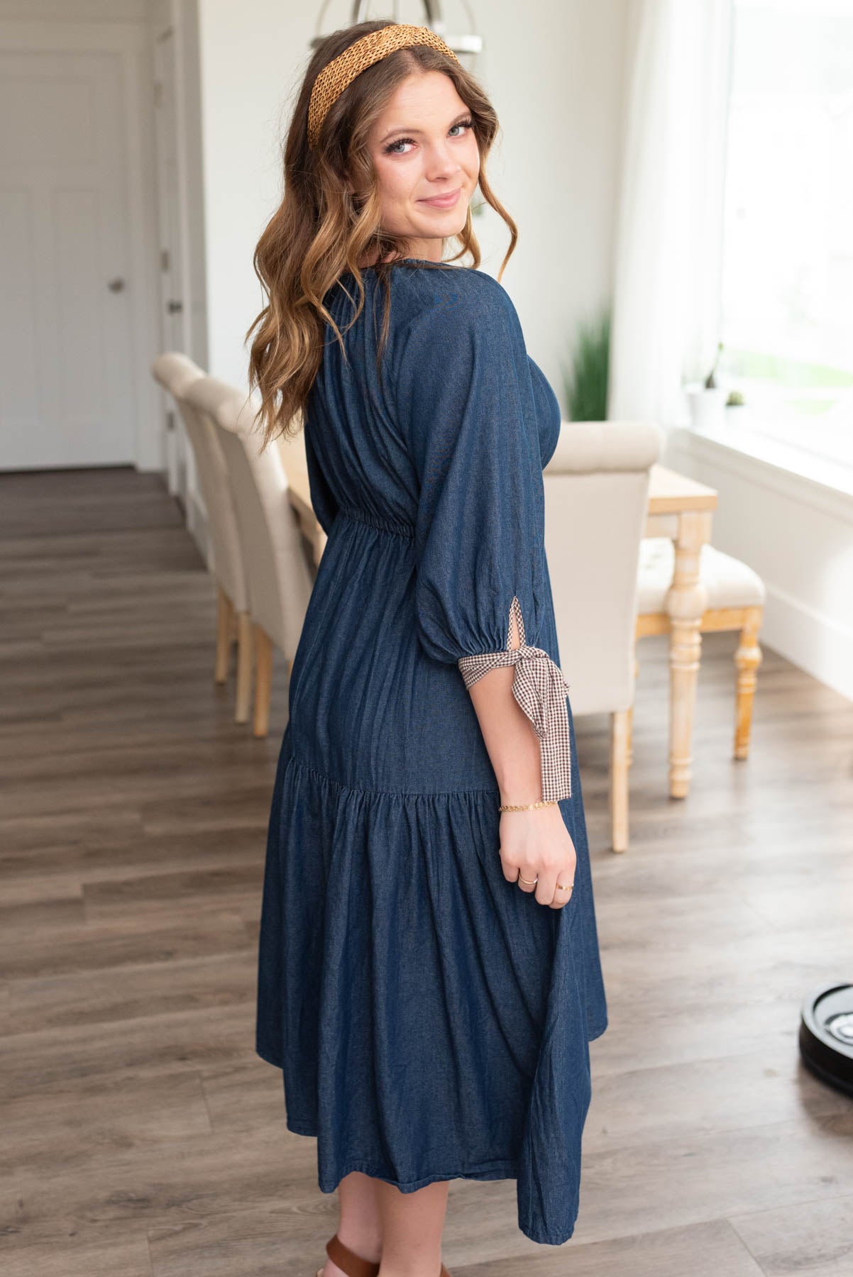 Side view of the dark denim tiered dress