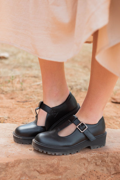 Side view of the black mary jane shoes