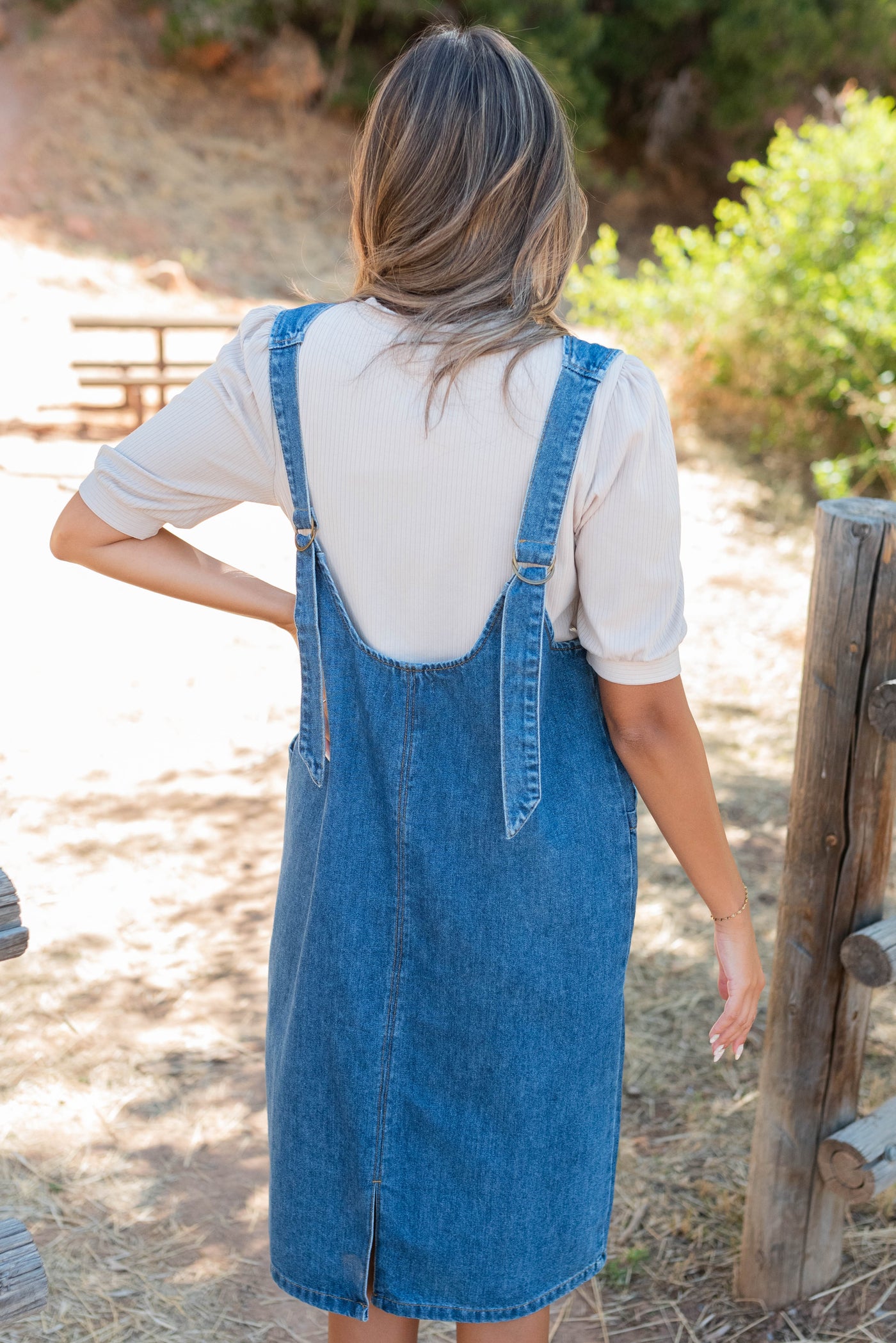 Back view of the indigo overall dress