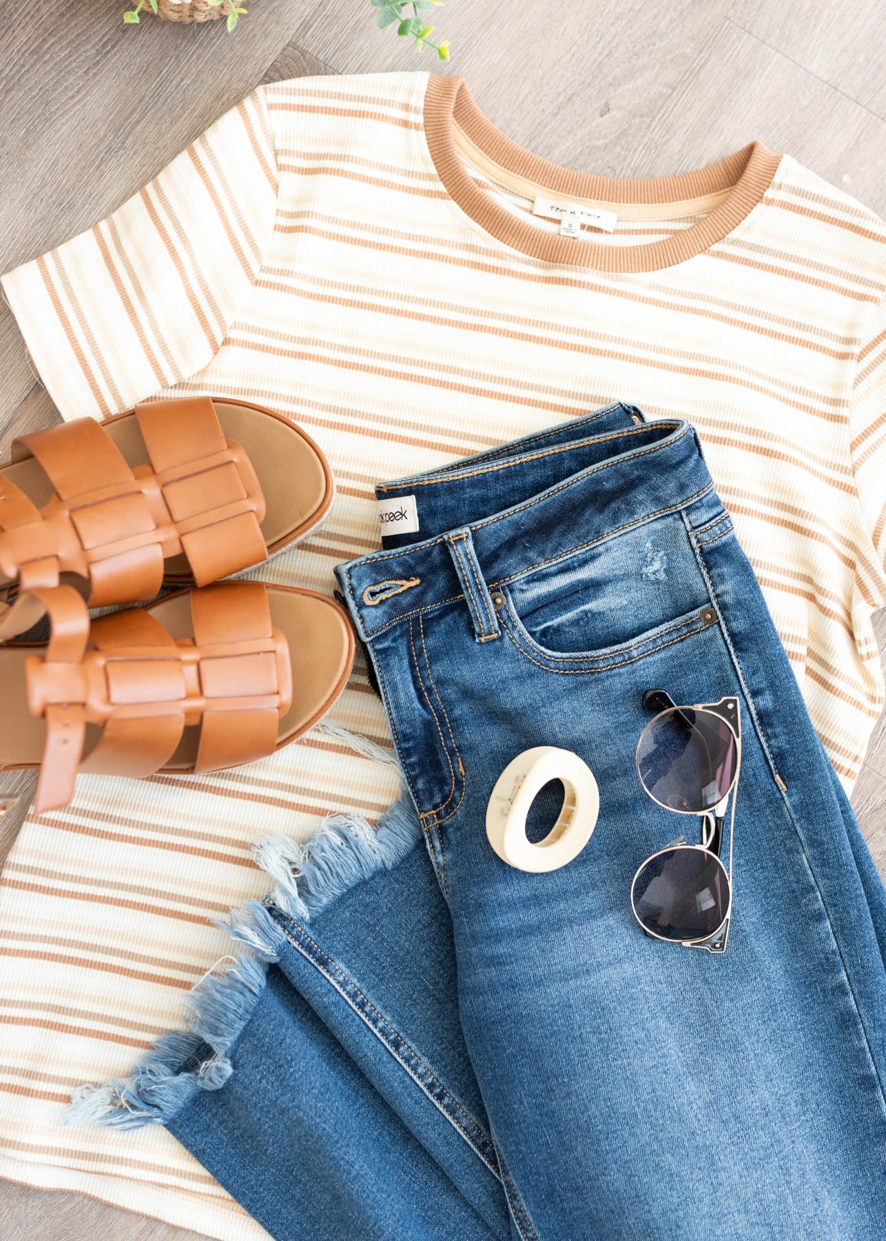 Taupe stripe top with jeans and shoes that complent the shirt