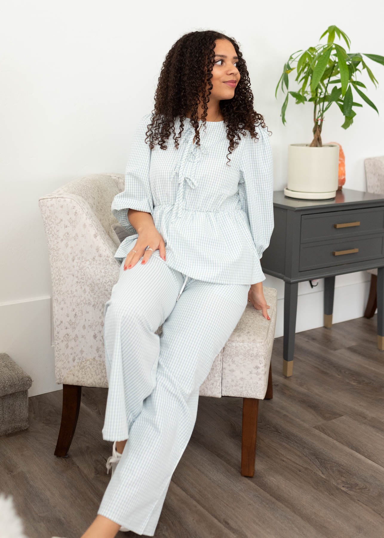 Light blue stirpe top with a peplum style