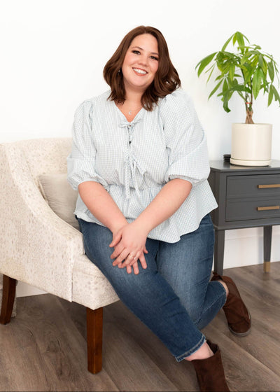 Plus size light blue stripe top with three ties on the bodice