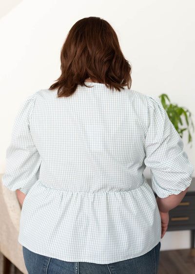 Back view of the light blue stripe top in plus size