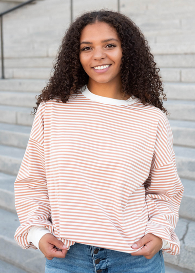 Latte top with white cuffs and neckline