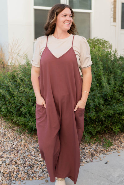 Front view of the mahogany woven overalls in plus size