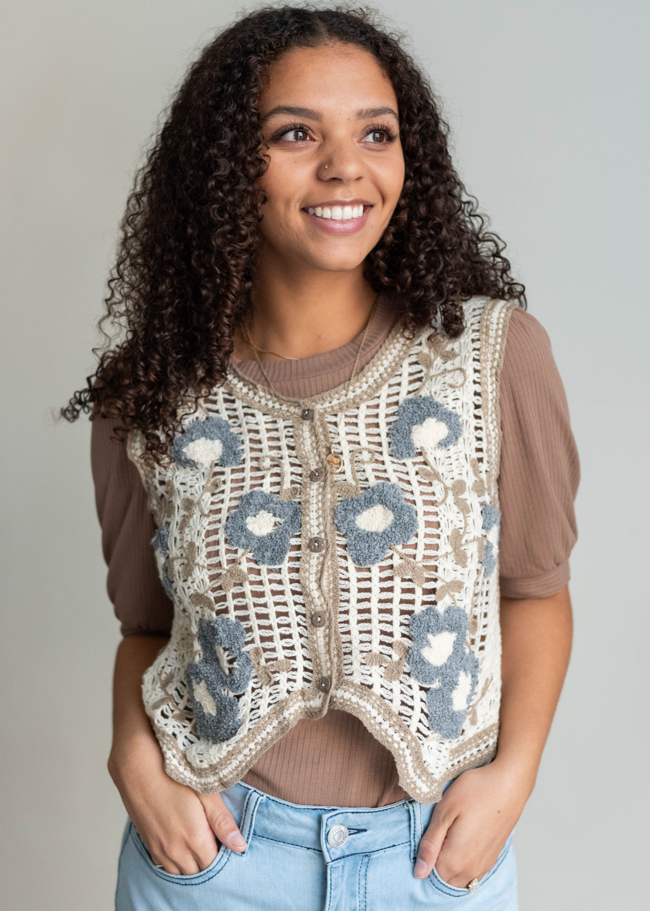 Cream floral crochet vest with blue flowers